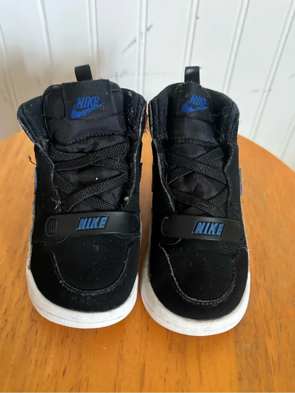Nike Kids Black Sneakers with Blue Logo Accent